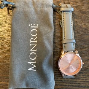 Watch with gray wristband and rose gold face